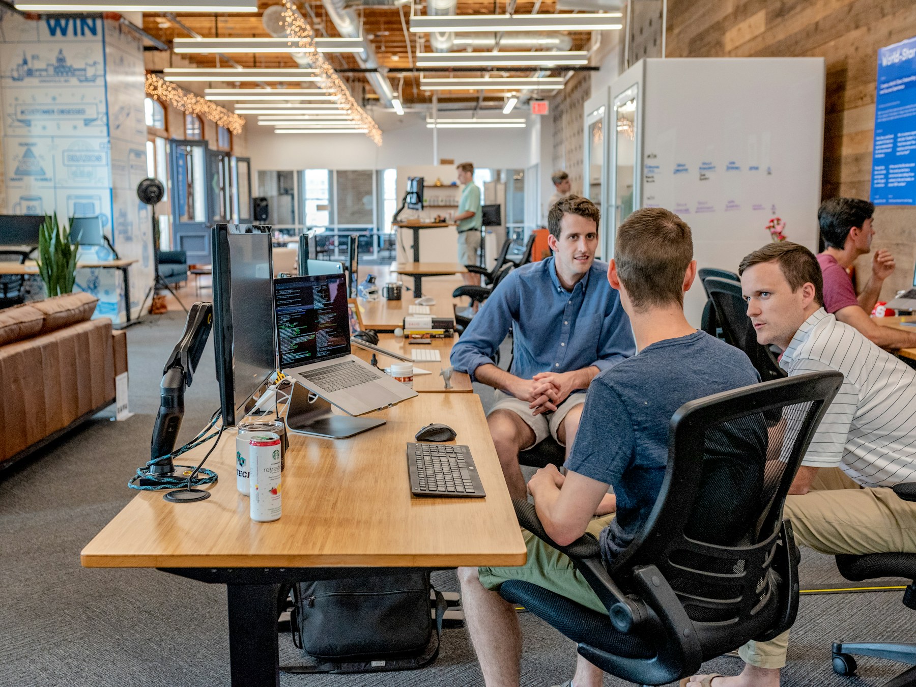 Professionals collaborating on compliance documentation in an office